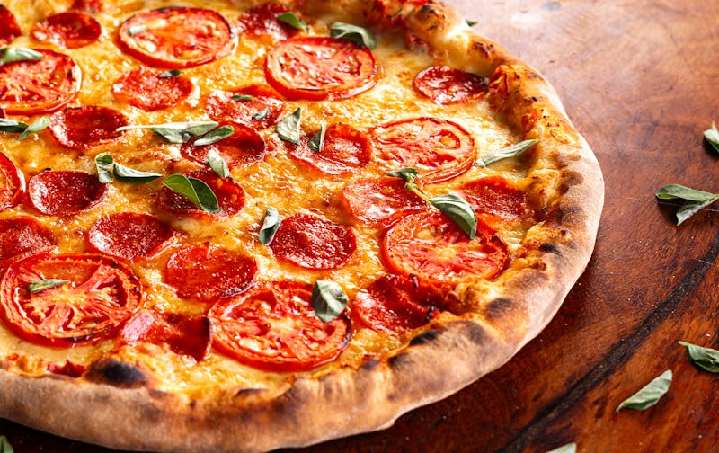 Spicy pepperoni pizza with chili flakes