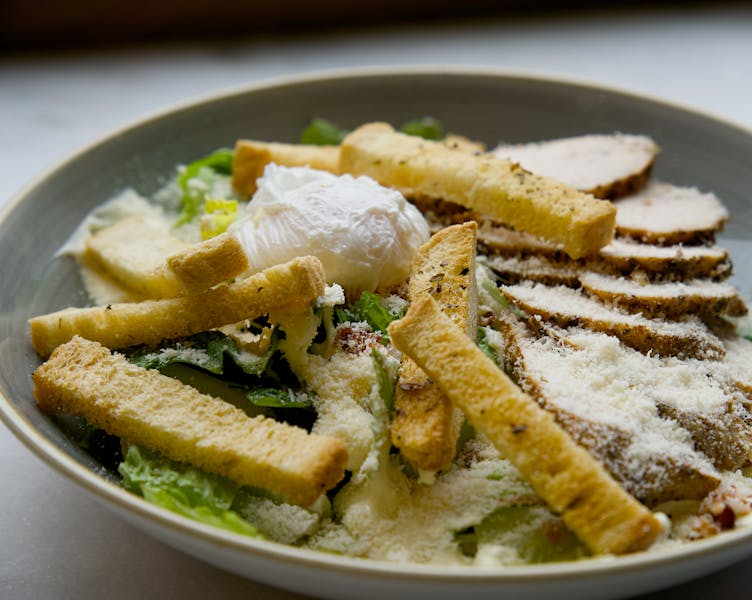 Classic Caesar salad with croutons and parmesan